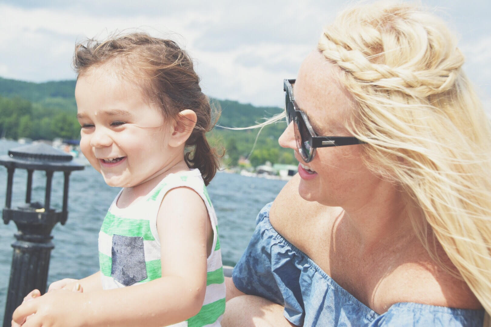 Mom and Child laughing on lake