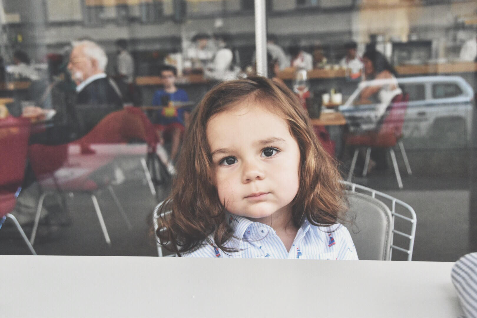 toddler sitting outside Untitled restaurant at the whitney museum niece