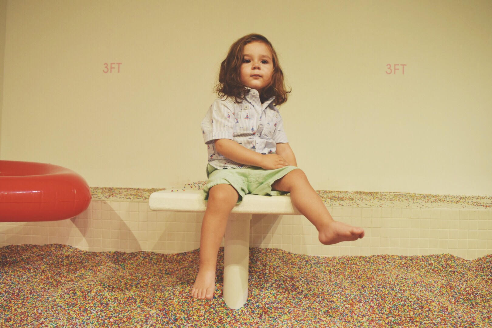 toddler at museum of ice cream sprinkle pool