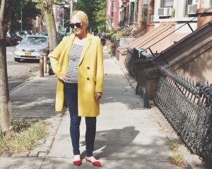 Chondra Sanchez in yellow Lafayette 148 coat on Brooklyn street